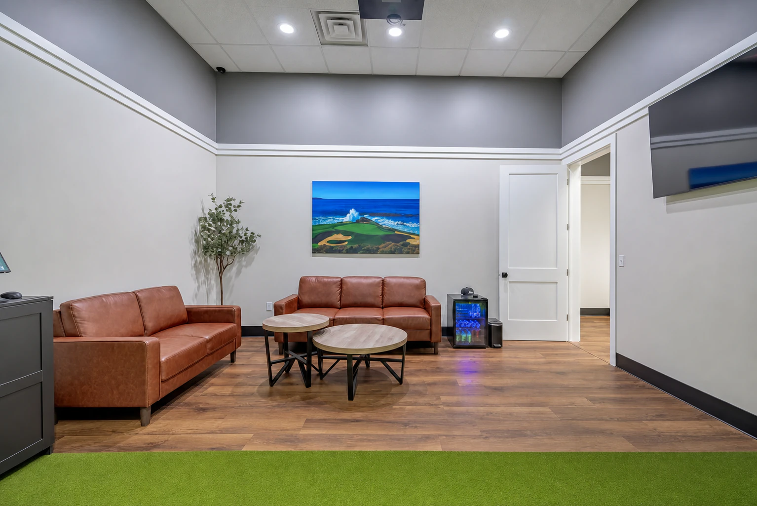 Comfortable work and lounge space inside a Rozay Golf bay